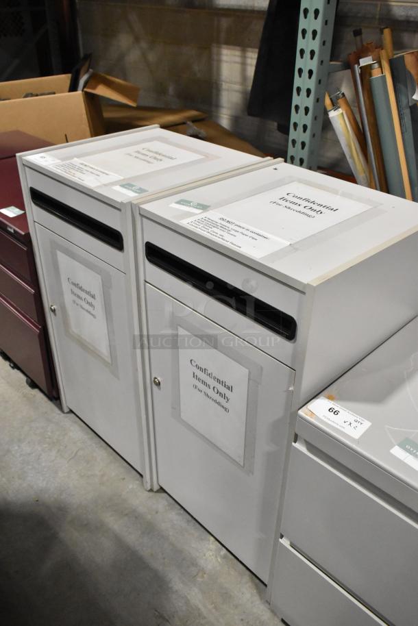 Two white drop cabinets for shredding documents, labeled “Confidential Items Only.” Sturdy, secure design in good condition.