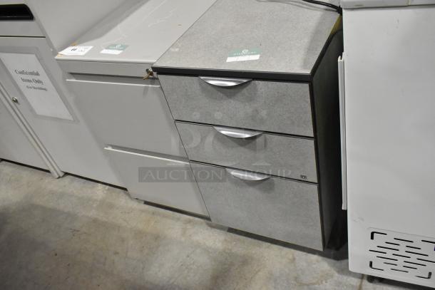 Two filing cabinets: one with three drawers and another with two drawers. Light gray, metal handles. Good condition.
