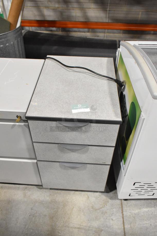 Two filing cabinets, one 2-drawer and one 3-drawer, with a gray finish. Includes lock and key. Label indicates "Overnight."