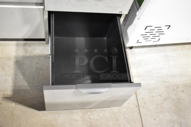 Two filing cabinets, including a 2-drawer and a 3-drawer, in used condition. Open drawer visible.