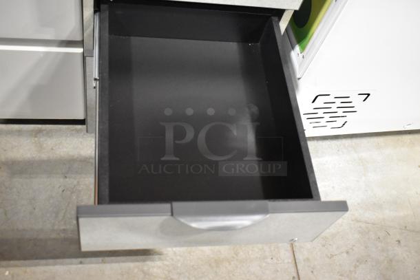 Two filing cabinets, one with 2 drawers and another with 3 drawers. Silver handles, in used condition.