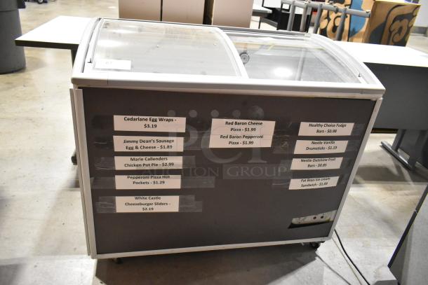 Healthy Choice SD-220Y commercial freezer with sliding doors, labeled pricing on front, 110 volts, 1 phase, metal construction.