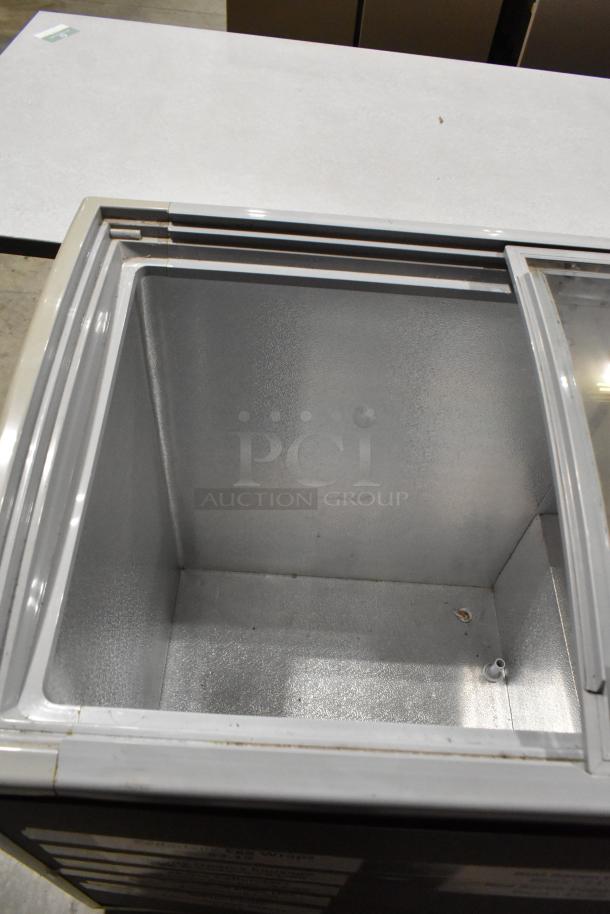 Healthy Choice SD-220Y metal commercial freezer merchandiser, 110V, 1 phase. Interior view, clean, good condition.