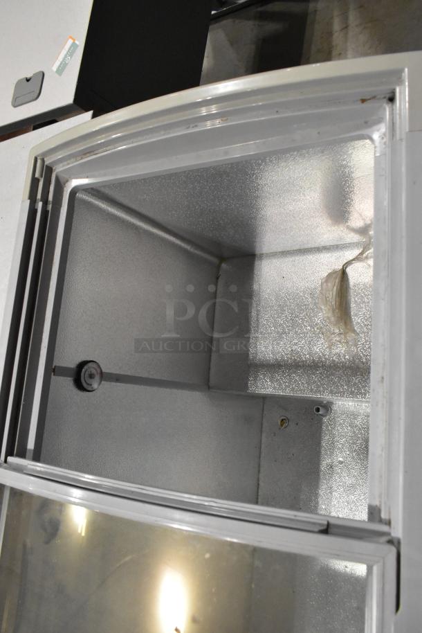 Healthy Choice SD-220Y metal commercial freezer, 110V, 1 Phase, interior view, light wear, includes shelving.