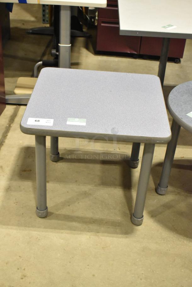 Gray end tables; one square, one round. Metal legs, tags labeled “68” and “219” indicate auction ID. Good condition.