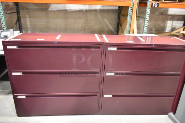 2 maroon metal 3-drawer filing cabinets, modern design. Good condition, ideal for office organization.