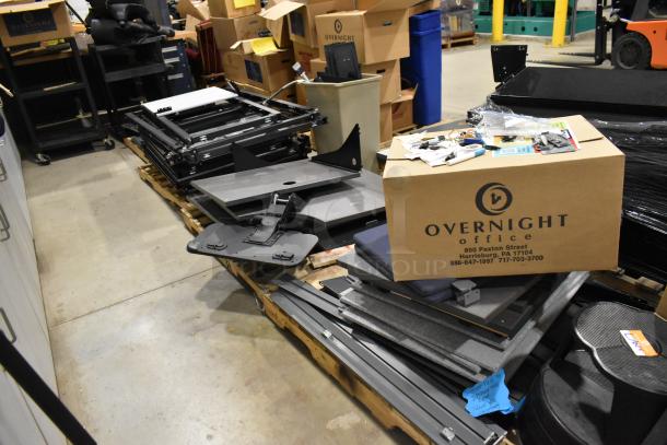 6 pallets of various items including metal pallet racking and gray desk panels. Overnight Office box visible.