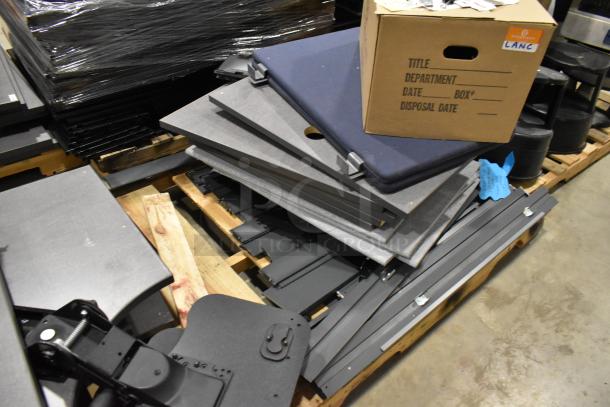 Six pallets containing metal pallet racking and gray desk panels in used condition with a cardboard box labeled "LANC."