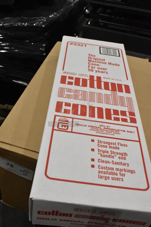 Pallet lot with assorted items including a box of Gold Medal cotton candy cones, labeled for strength and hygiene features.