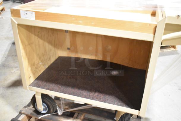 2-tier cart on casters, wooden and metal construction, light brown finish, storage capacity, minor wear, item tag visible.