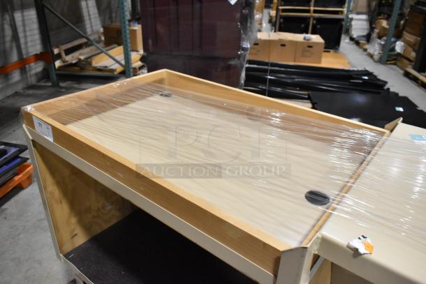 2-tier cart on casters, wood frame, plastic wrap cover, visible label "77", in storage setting. Good condition.