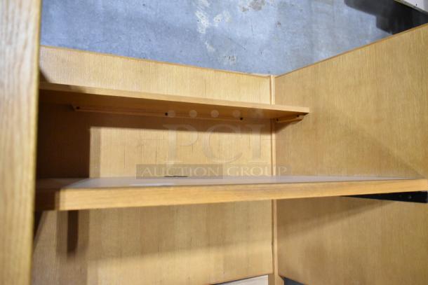Wood pattern desk with upper shelf in light oak finish. Features durable surface, minor wear, ideal for office or study.