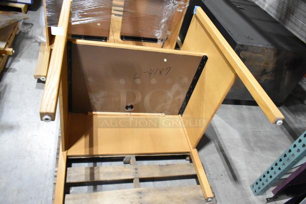 Wood pattern desk with detachable legs, showing underside. Marked "L-4187." Assembled condition unknown.