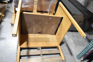 Wood pattern desk with detachable legs, showing underside. Marked "L-4187." Assembled condition unknown.