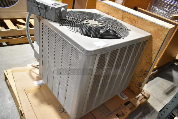 Rheem 13PJA24A01 air conditioner condenser, metal construction, 208/230 volts, 1 phase. Appears in good condition.