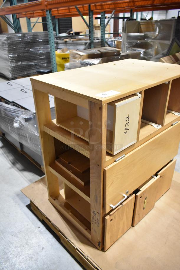 Wood pattern cabinet with a door and four drawers, showing sturdy build, minor wear. Markings: "432" on a drawer.