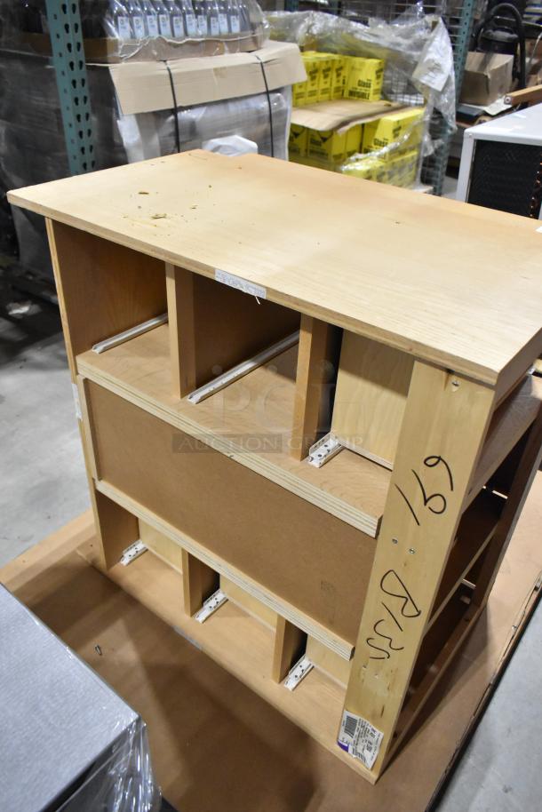 Wood pattern cabinet with door and four drawers, unfinished condition. Features slots for drawers and visible side markings.