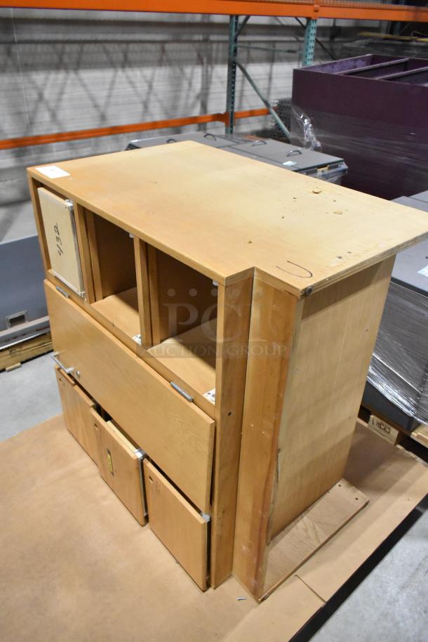 Wood pattern cabinet with single door and four drawers. Visible wooden texture, moderate wear, ideal for storage.