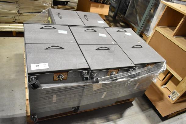 4 gray two-drawer filing cabinets with casters, stacked on a pallet. Handles on each drawer, labeled "92 Qty."