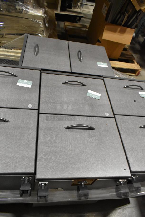 4 gray 2-drawer filing cabinets on casters, pre-owned. Each has secure locks and handles. Visible tags indicate auction.