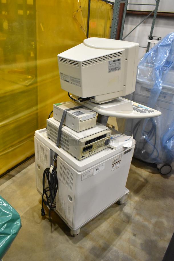 Philips M2540A Ultrasound System on casters, includes monitor and controls. Visible labels and power cables. Good condition.