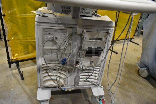 Philips M2540A Ultrasound System on casters, showing cables and control panel. Used condition, suitable for medical imaging.