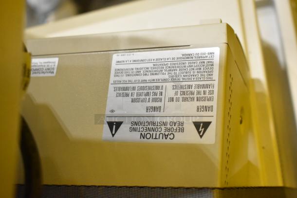 Philips M2540A Ultrasound System on casters, featuring caution labels. Ideal for medical diagnostics.