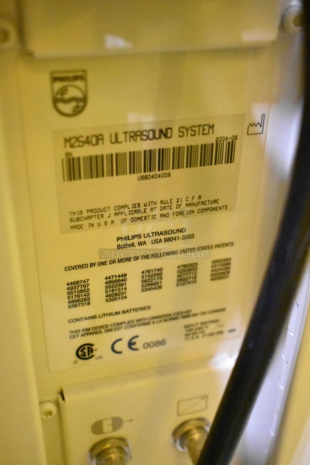 Philips M2540A Ultrasound System on casters, featuring a compliance label with U.S. and CE certifications.