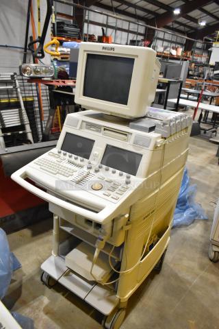 Philips M2424A Ultrasound System on casters, features monitor, control panels, in used condition.