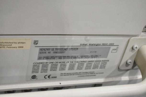 Philips M2424A Ultrasound System label showing model, serial number, CE mark, and refurbishment date, February 2008.