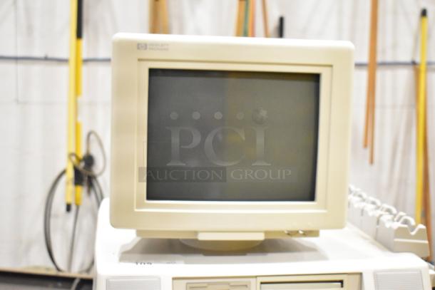 Hewlett Packard HP Ultrasound System on casters, featuring a CRT monitor. Clean exterior, visible HP logo on top bezel.