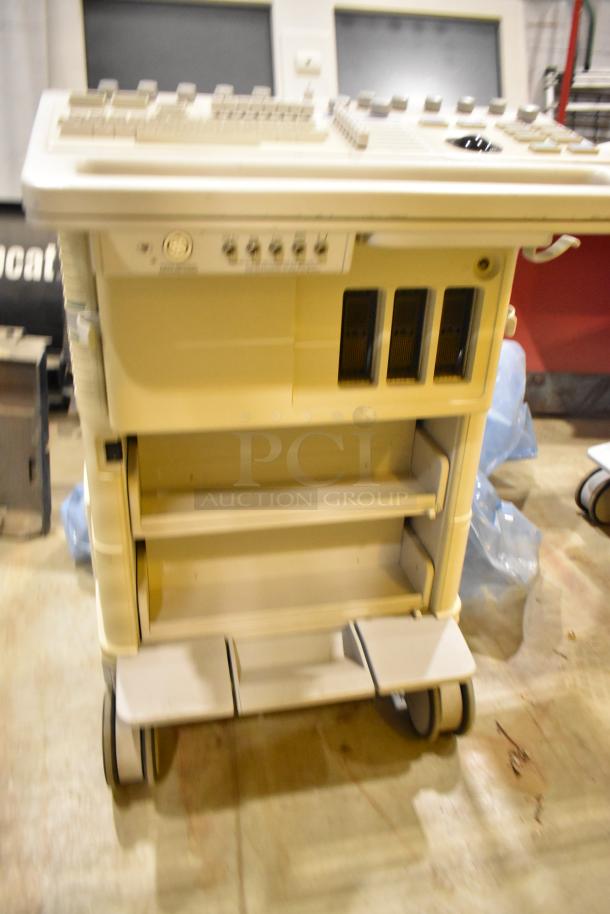 Hewlett Packard HP Ultrasound System on casters, beige, multiple control buttons, shelves, used condition.