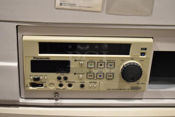 Hewlett Packard HP Ultrasound System with Panasonic AG-MD830 recorder, in used condition. Features include control panel, display screen.