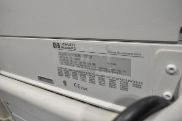 Hewlett Packard HP K2412A Ultrasound System label, serial number visible, on casters, in used condition.