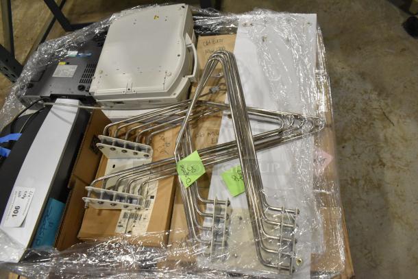 Pallet of medical equipment including Bionet CardioTouch-3000 ECG and GE Medical MAC1200 EKG, stacked and wrapped.