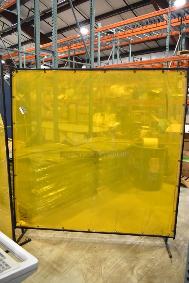 Two Steiner Industries safety screens with yellow translucent material and black metal frames, in good condition.