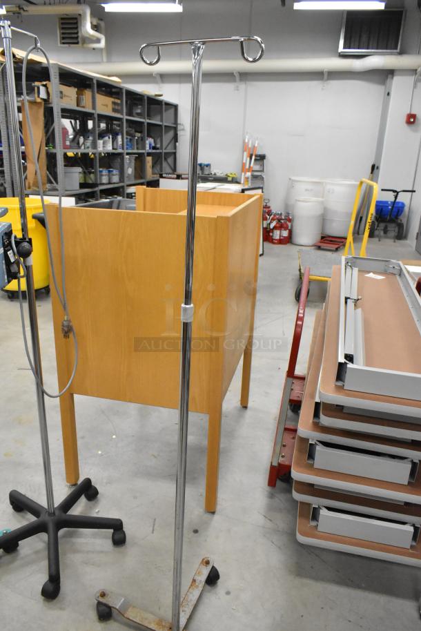 Three items: Two Alaris Signature Edition infusion systems on casters, plus one stand with caster base, in a warehouse setting.