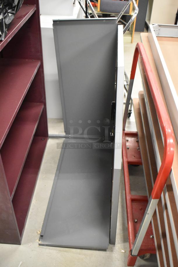 Maroon metal bookshelf and filing cabinet, both in good condition, with adjustable shelves and five drawers respectively.