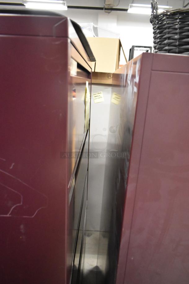 Maroon metal bookshelf and 5-drawer filing cabinet, slightly worn, features industrial design. Includes additional item.