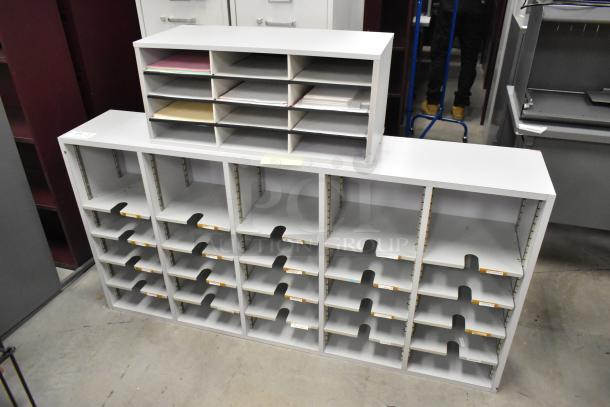 Two countertop multi-cubby mailboxes in gray, each with multiple compartments. Clean condition, ideal for organizing documents.