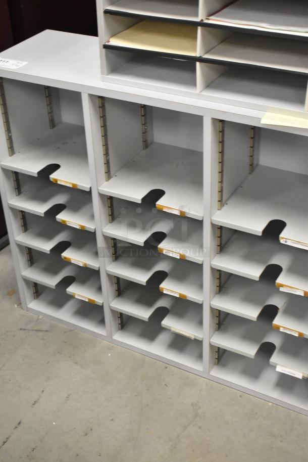 2 countertop multi-cubby mailboxes, gray, multiple shelves, good condition, adjustable slots, for organizing mail.