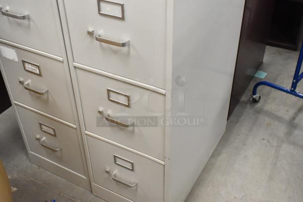 Two gray metal 4-drawer filing cabinets, used condition, sturdy handles, label holders; doubles bid value.