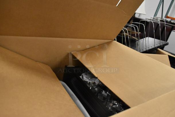 Three open boxes with assorted office items including staplers, racks, and storage bins, in good condition.