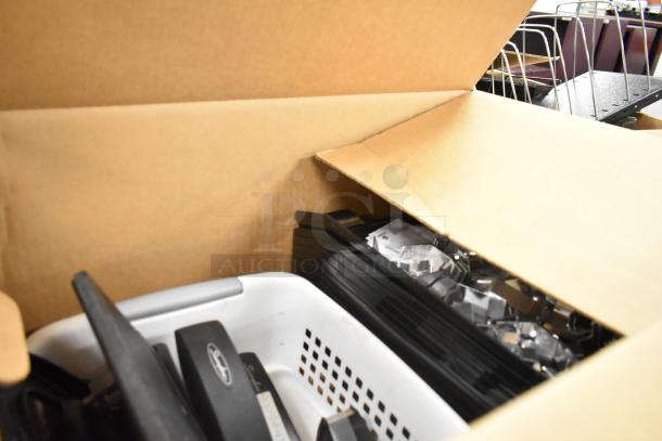3 boxes of various items including staplers, rack, and bins. Includes assorted office supplies. Labels partially visible.