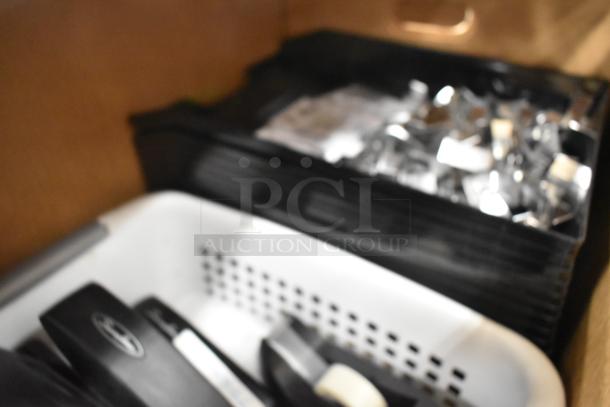 Three boxes containing staplers, a document rack, and bins. Includes mixed office supplies. Condition: Used.