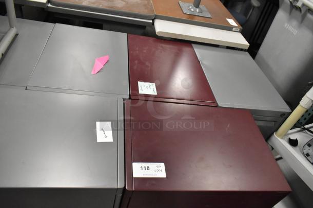 Four filing cabinets on casters, including a 3-drawer maroon and 2-drawer gray. Tags indicate auction lot and rework.