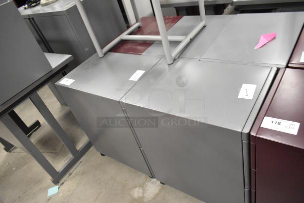 Four filing cabinets on casters, including a 3-drawer maroon and a 2-drawer gray. Labels indicate "Lot 118" and "Quantity x4".