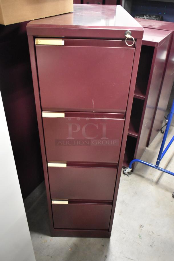 Maroon metal 4-drawer filing cabinet, visible minor wear, gold handles, lockable. Includes two cabinets per bid.