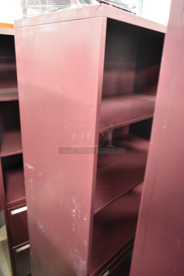 Three maroon metal book shelves, sturdy construction, minor scratches visible. Ideal for office or home use.