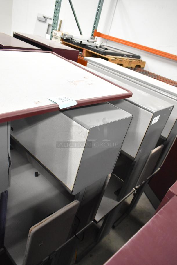 Two light gray desks with overhead cabinets, lightly worn surface. Note indicating "2 Times Your Bid" attached.
